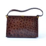 A vintage Fassbender handbag, in brown crocodile skin, with a pig skin lined interior and original