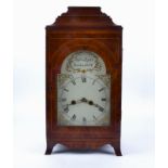 An early 19th Century pendulum clock by Joshua Bates, the carved walnut case strung with boxwood,