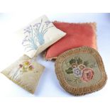 A selection of vintage and contemporary cushions, cotton, velvet and woven fabric examples, with