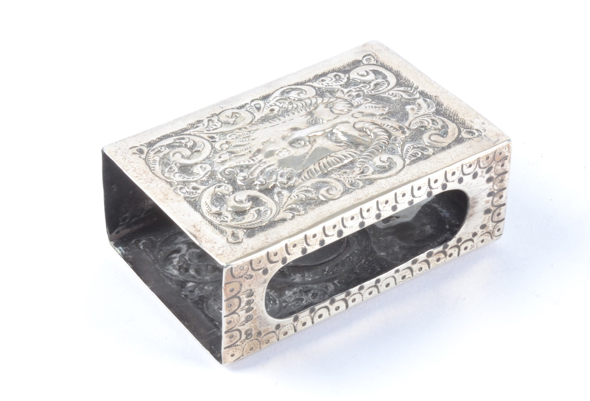 A Charles Boynton hallmarked silver match case holder with repousse decoration of 'The Green Man',