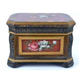 A large 20th Century carved box with a swing top, edges with motifs and painted floral decoration on