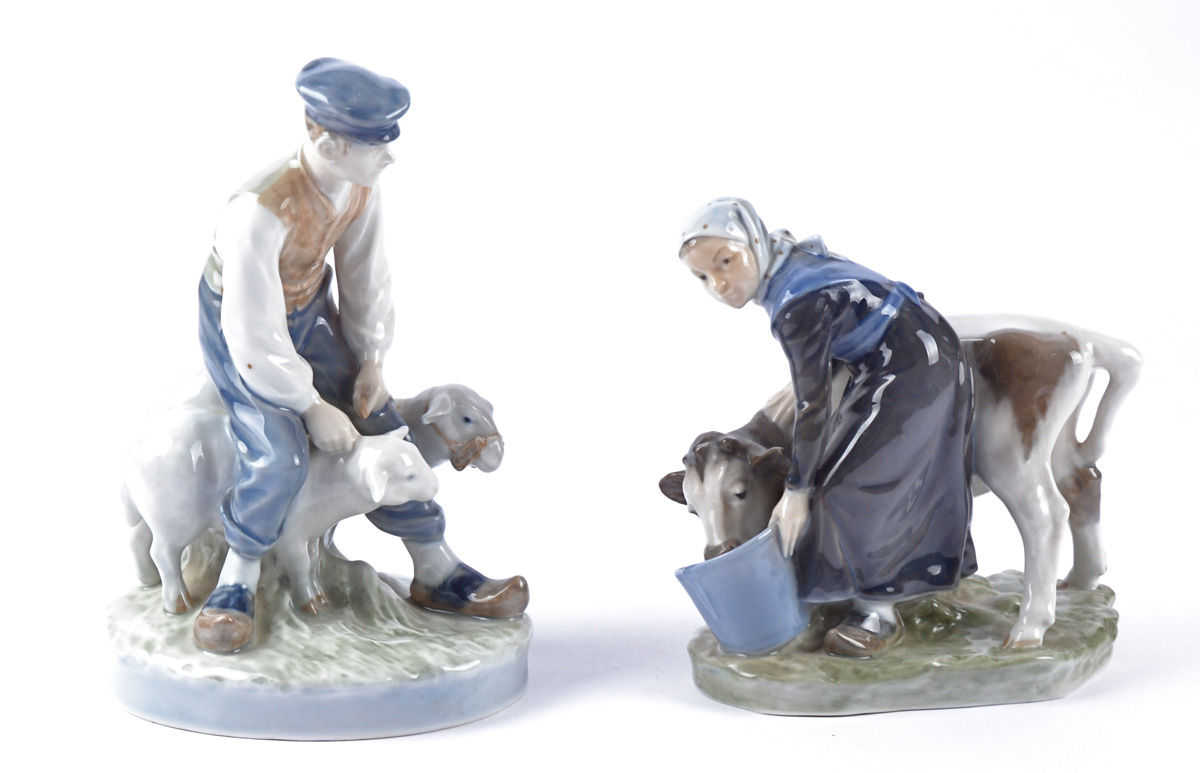 A Royal Copenhagen porcelain figure of a farmer with sheep, no.627, with factory marks to base,