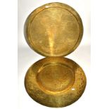 Two substantial 20th Century Eastern brass chargers, one Chinese with central decoration of