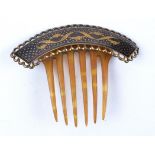 An early 20th Century comb with raised metalwork decorative Damascene style panel, 8.5cm x 11.5cm