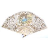 A late 19th Century folding fan, the bone monture and guards with studded and gilt decoration, the