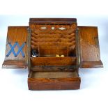 A Victorian oak hall letter rack or stationery box, with internal perpetual calendar and multiple