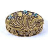 An Arts & Crafts polished brass oval box, with floral decoration and inset with stones, hinged