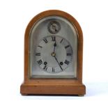 A early 20th Century bracket clock, silvered dial with Roman numerals, subsidiary dial above, 8