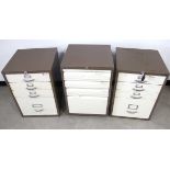 Three Bisley metal filing cabinets, all with one file drawer and three other drawers, two