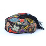 A early 19th Century black smoking cap, with hand embroidered with coloured threads, beading and