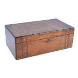 A 19th Century walnut travelling writing slope with red baize interior, the top with central
