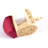 A 19th Century Chinese ivory Canton carved sewing clamp, topped with a red silk pin cushion