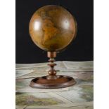A pair of Newton's terrestrial and celestial globes on turned stands dated 1851, with brass