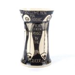 A Susan McGill pottery candle holder, glazed in white and decorated with the black outline of fish