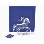 Swarovski crystal model of a galloping horse, in the original box with certificate, height 14.5cm