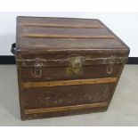 A Steamer Travel trunk by John Cattnach of New York, having leather carry handles to either side,