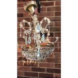 A 20th Century four branch glass circular chandelier, of basket form, with glass sconces, faceted