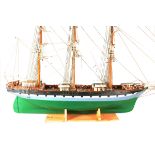 A 20th Century painted wooden model of the Clipper 'Southern Cross', the weighted hull of carvel-