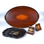 A mahogany oval tray with shell motif, length 67cm, together with a pair of mahogany bookends and