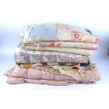 A quantity of mid 20th Century blankets and quilts, in assorted colours and designs, variety of