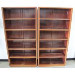 A pair of 20th Century Chinese hardwood bookcases, two fixed and three adjustable shelves to each,