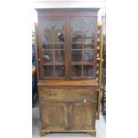 A 19th Century mahogany secretaire bookcase, moulded cornice, over gothic glazed doors, the interior