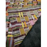 A Ewe woman's woven multi-coloured Kente cloth, 270cm x 180cm