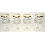 Four German glasses with engraved interlaced decoration surmounted by crowns, raised on multifaceted