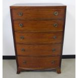 An Edwardian Mahogany bow fronted chest of drawers, having five graduated drawers, inlaid work to