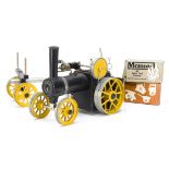 A Kit-built Mamod live-steam Tractor and Log Trailer, in black with yellow wheels and flywheel,