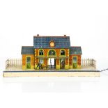 A French Hornby 0 Gauge No 2 (tinplate) Station, the lithographed red-brick building with blue-tiled