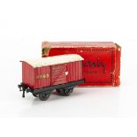 A rare French Hornby 0 Gauge 'Wagon A Poudre' (Gunpowder) Van, in red with black/red-edged gold '