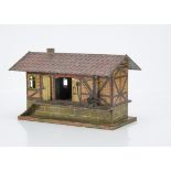 An uncommon Early Märklin Gauge 1 Hand-painted Double-sided Goods Shed, with raised platform to each