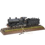 A possibly Bing/Bassett-Lowke Gauge 1 clockwork LMS 4F 0-6-0 locomotive and tender, certainly with a