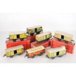 Seven French Hornby O Gauge No 1 S Freight Vehicules, lithographed vans with sliding doors,