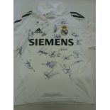 Real Madrid, an autographed replica child's home shirt, fully signed by 20 players, including