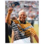 NELSON MANDELA Signed Colour photograph of Nelson Mandela in a South Africa football shirt. Measures