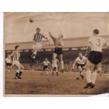 BRIAN CLOUGH Press photo of Brian Clough winning a ball in the air against Liverpool probably in the