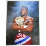 FRANK BRUNO Col 16 x 12 photo of Bruno posing with the World Heavyweight belt, signed Best Wishes in