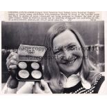 MARY PETERS AUTOGRAPH A 10" X 8" black & white signed Press photograph of Peters holding here medals