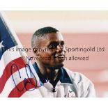 CARL LEWIS AUTOGRAPH A 10" X 8" signed colour Press photograph in blue marker pen. Good