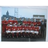 MANCHESTER UTD 1964 Col 16 x 12 photo of players posing for a squad photo at Old Trafford prior to