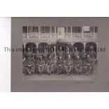 WARTIME FOOTBALL A mounted 8" X 6" black & white team group of the Military team in army uniform