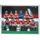 MANCHESTER UTD 1977 Col 16 x 12 photo of the 1977 FA Cup winners posing with their trophy during a