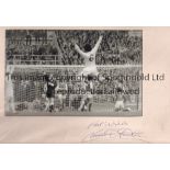 NORMAN HUNTER AUTOGRAPH A mounted 12" X 8" black & white photograph of Leeds United scoring in the