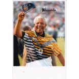 NELSON MANDELA Signed Colour photograph of Nelson Mandela in a South Africa football shirt. Measures