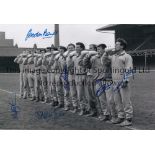 LEICESTER B/w 12 x 8 photo of players standing shoulder to shoulder as they each down a bottle of