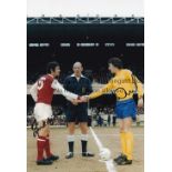 MCLINTOCK AND MCFARLAND Col 12 x 8 photo of Derby County captain Roy McFarland shaking hands with