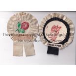 ENGLAND RUGBY UNION Two England Rugby rosettes probably from the 1970's. Lacking pins. Some wear.