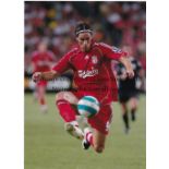 LIVERPOOL Three 11" X 8" colour photographs, one action photo signed by El Hadji Diouf and 2